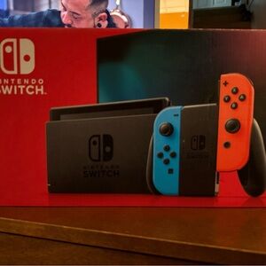 Nintendo Switch Console with Neon Red and Blue Joy-Con